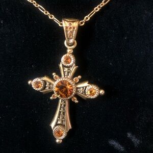 Ornate amber rhinestone cross necklace marked JBK 1 1/2” cross on 10” chain